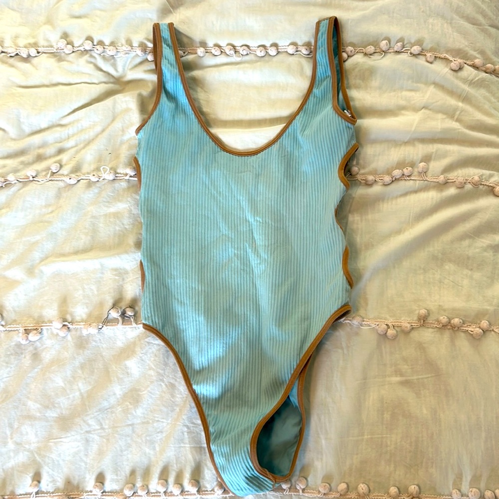 Urbann Outfitters Swimsuit. Size: Medium/Small. Color Blue with brown slits.